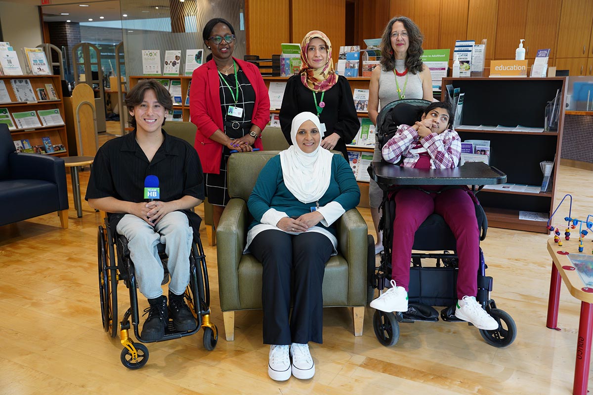 Front row L to R: Tai Young, Holland Bloorview ambassador and former client, Sharda Ali-Ramjattan, family leader and her daughter Selina, a client at Holland Bloorview Back row L to R: Holland Bloorview staff:Terry Mutuku, senior communications associate, Ruveyda Durmus, spiritual care practitioner, Vera Nenadovic, nurse practitioner.